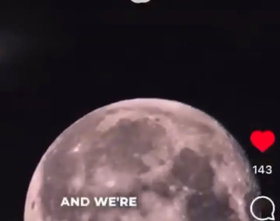 A rocket climbing at night, its flame trailing behind it.