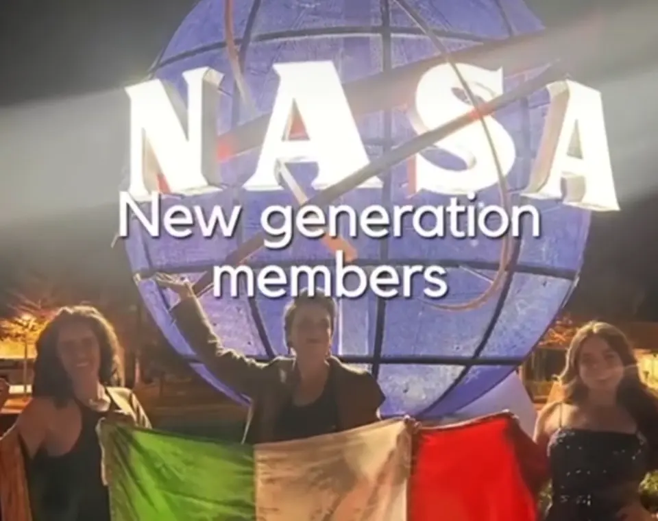 The NASA globe, and a group holding the Mexican flag in front of it.